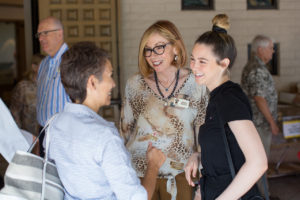 Families greeting each other after worship.